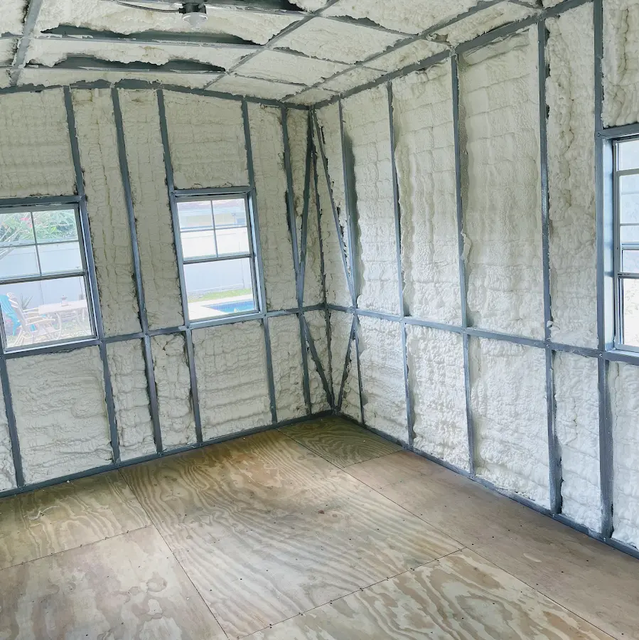 Closed-cell spray foam insulation applied to wall cavities in a residential project in Gentry